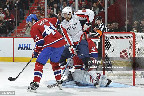 Eric Fehr of the Washington Capitals disturbs goalie Jaroslav Halak of Montreal Canadiens in Game Six of the Eastern Conference Quarterfinals during...