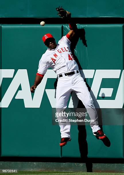 Torii Hunter of the Los Angeles Angels of Anaheim jumps at the wall but can't catch a double hit by Austin Kearns of the Cleveland Indians in the...