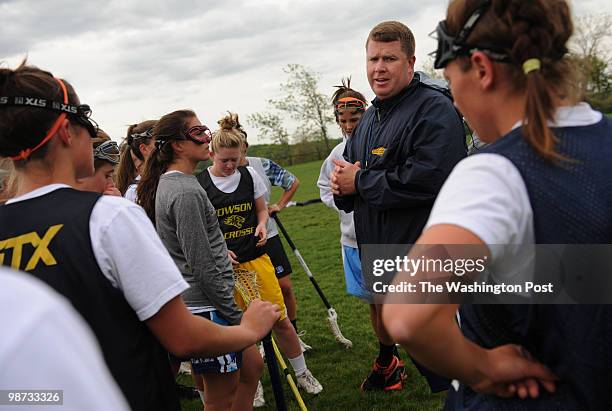 Good Counsel girl's varsity lacrosse coach Mike Haight talks with his team during practice at Good Counsel on Tuesday, April 27, 2010. The Falcons...