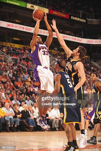 Grant Hill of the Phoenix Suns shoots the ball against Josh McRoberts of the Indiana Pacers in an NBA Game played on March 6, 2010 at U.S. Airways...