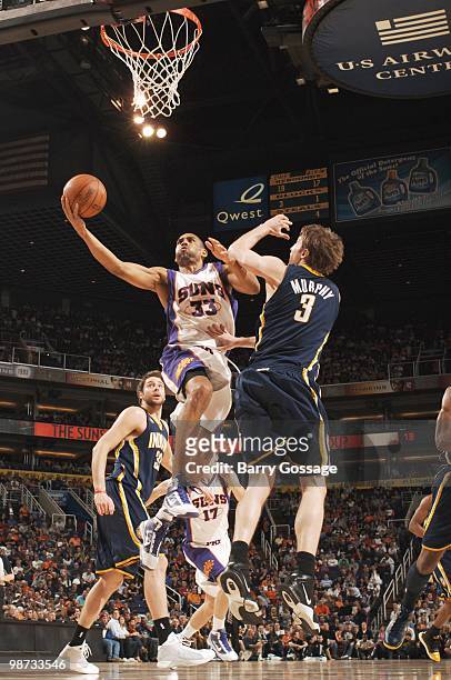 Grant Hill of the Phoenix Suns takes a shot against Troy Murphy of the Indiana Pacers in an NBA Game played on March 6, 2010 at U.S. Airways Center...