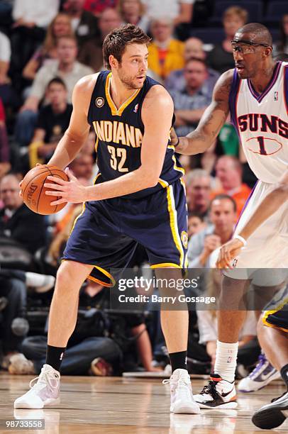 Josh McRoberts of the Indiana Pacers looks to move the ball against Amar'e Stoudemire of the Phoenix Suns in an NBA Game on March 6, 2010 at U.S....