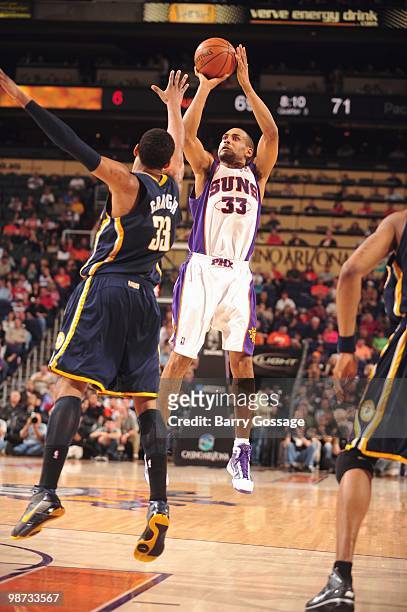 Grant Hill of the Phoenix Suns shoots the ball against Danny Granger of the Indiana Pacers in an NBA Game played on March 6, 2010 at U.S. Airways...