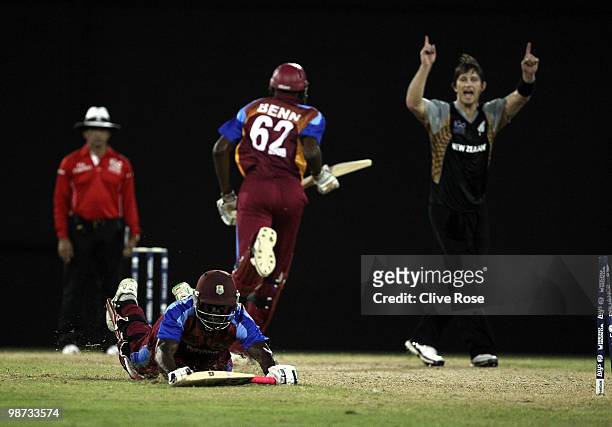 Andre Fletcher of West Indies fails to make his ground and is run out as Shane Bond of New Zealand celebrates during the ICC T20 World Cup warm up...