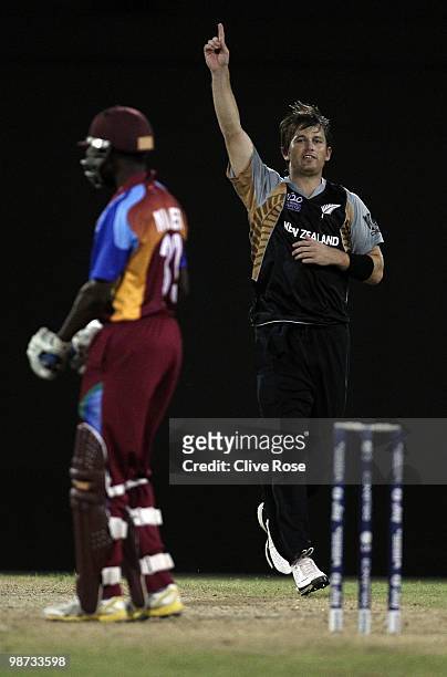 Shane Bond of New Zealand celebrates the wicket of Nikita Miller of West Indies during the ICC T20 World Cup warm up match between West Indies and...