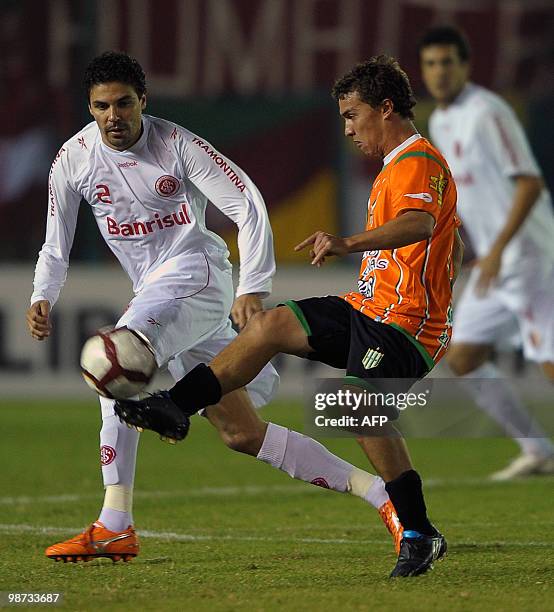 Argentina's Banfield forward Sebastian Fernandez vies for the ball with Brazil's Internacional defender Bolivar during their Copa Libertadores 2010...