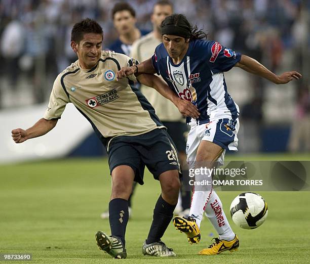 Damian Alvarez of Pachuca vies for the ball with Hector Gutierrez of Cruz Azul during their second leg final football match of the CONCACAF Champion...