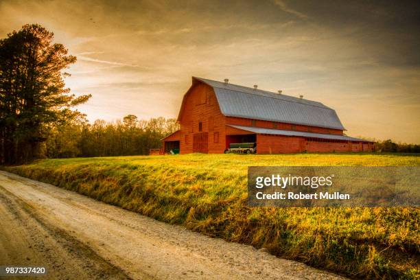 old red barn - sunset place stock pictures, royalty-free photos & images