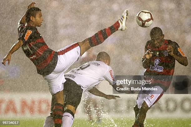 David and Willians of Flamengo fight for the ball with Ronaldo of Corinthians during a match as part of the Libertadores Cup at Maracana Stadium on...