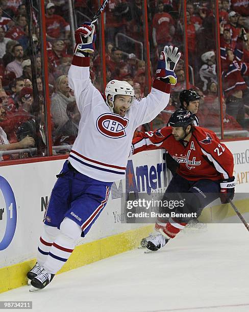 Dominic Moore of the Montreal Canadiens scores the game winning goal in the third period against the Washington Capitals in Game Seven of the Eastern...