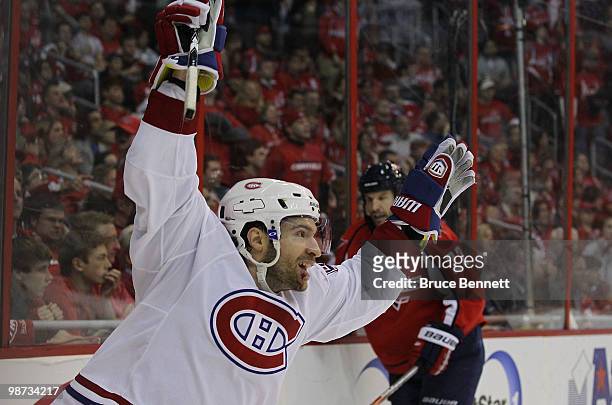 Dominic Moore of the Montreal Canadiens scores the game winning goal in the third period against the Washington Capitals in Game Seven of the Eastern...