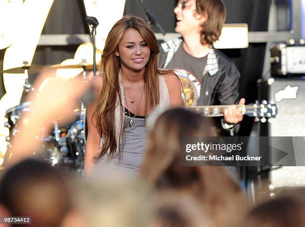 Singer Miley Cyrus performs at the Make-A-Wish Foundation's "World Wish Day" at The Grove on April 28, 2010 in Los Angeles, California.