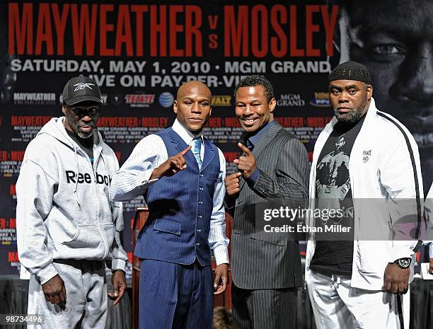 Trainer Roger Mayweather, boxer Floyd Mayweather Jr., boxer Shane Mosley, and his trainer Naazim Richardson pose during their final news conference...