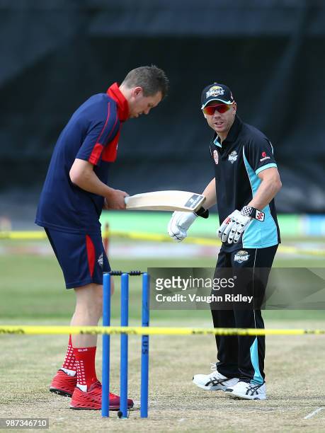 Peter Siddle of Montreal Tigers and David Warner of Winnipeg Hawks warms up prior to a Global T20 Canada match at Maple Leaf Cricket Club on June 29,...