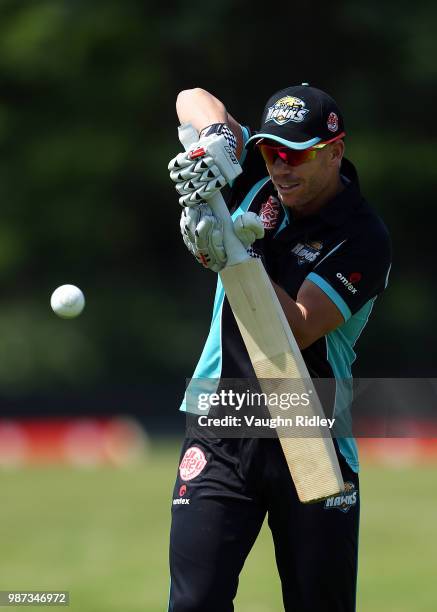 David Warner of Winnipeg Hawks warms up prior to a Global T20 Canada match against Montreal Tigers at Maple Leaf Cricket Club on June 29, 2018 in...