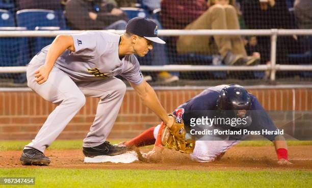 Portland Sea Dogs baserunner is tagged out by Trenton Thunder third baseman Mandy Alvarez while attempting to steal third at Hadlock Field on Friday,...