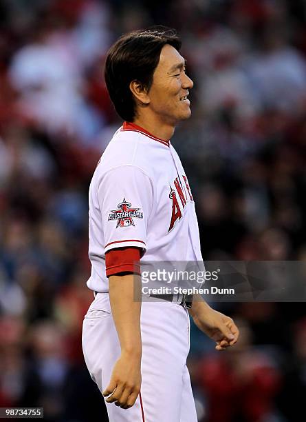 Hideki Matsui of the Los Angeles Angels of Anaheim smiles as his team celebrates their ninth inning victory over the Cleveland Indians on April 28,...