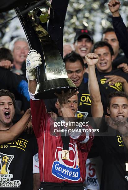 Pachuca's captain and goalie Miguel Calero lifts the thropy of the CONCACAF Champion League tournament after defeating Cruz Azul 1-0 on April 28,...