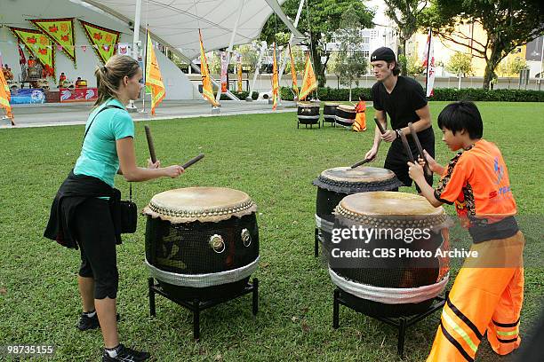 Dumb Did Us In" -- Dating models Caite and Brent complete Detour A in which they must learn and perform a drum routine from the traditional Lion...