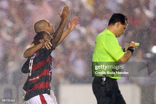 Vagner Love and Adriano of Flamengo celebrate a scored goal against Corinthians during a match as part of the Libertadores Cup at Maracana Stadium on...