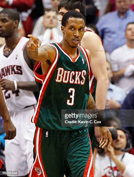 Brandon Jennings of the Milwaukee Bucks reacts after making a free throw against the Atlanta Hawks during Game Five of the Eastern Conference...