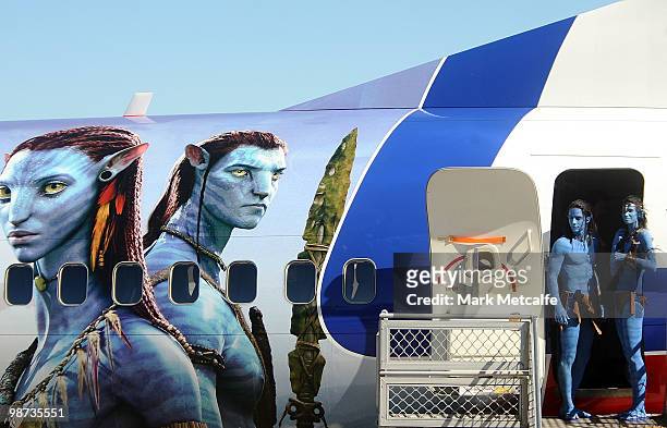 Models dressed up as characters from the film 'Avatar' depart a branded plane during the launch of "AVATAR" Blu-ray and DVD at Sydney Domestic...