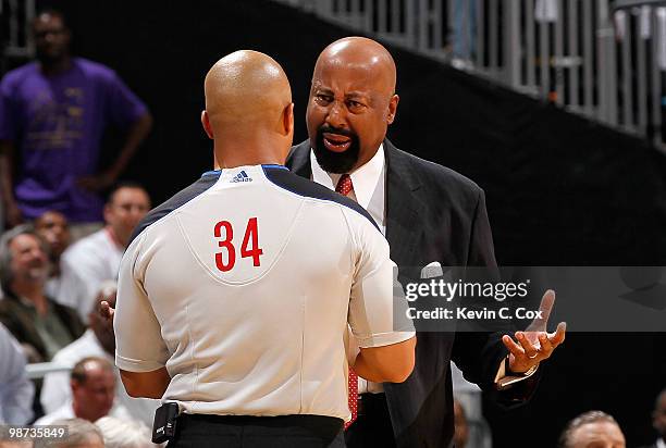 Head coach Mike Woodson of the Atlanta Hawks questions referee Marc Davis about a call during the game against the Milwaukee Bucks in Game Five of...