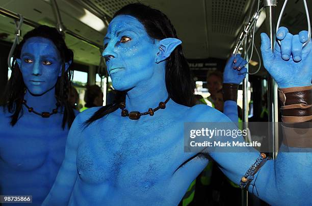 Models dressed up as characters from the film 'Avatar' travel on an airport shuttle bus during the launch of "AVATAR" Blu-ray and DVD at Sydney...