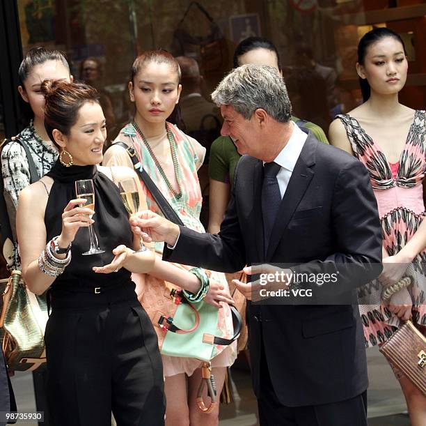 Yves Carcelle and Gong Li attend LV store ribbon-cuttting ceremony on April 28, 2010 in Shanghai, China.