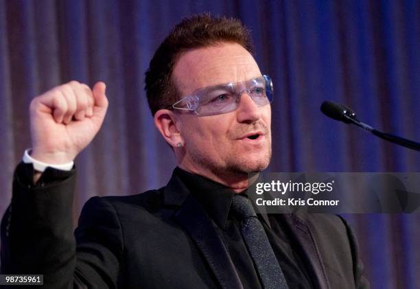 Frontman Bono speaks after being awarded the Distinguished Humanitarian Leadership Award during the 2010 Atlantic Council awards dinner at the Ritz...