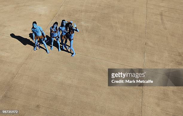 Models dressed up as characters from the film 'Avatar' pose on the tarmac during the launch of "AVATAR" Blu-ray and DVD at Sydney Domestic Airport on...