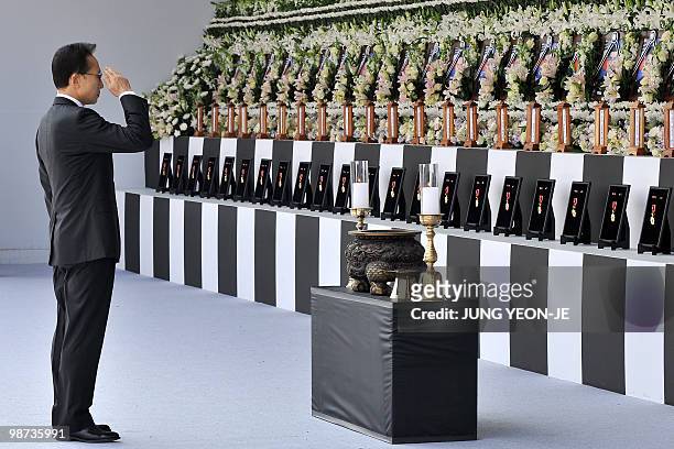 South Korean President Lee Myung-Bak salutes the portraits at an altar for the sailors who died when the South Korean warship Cheonan sank during a...