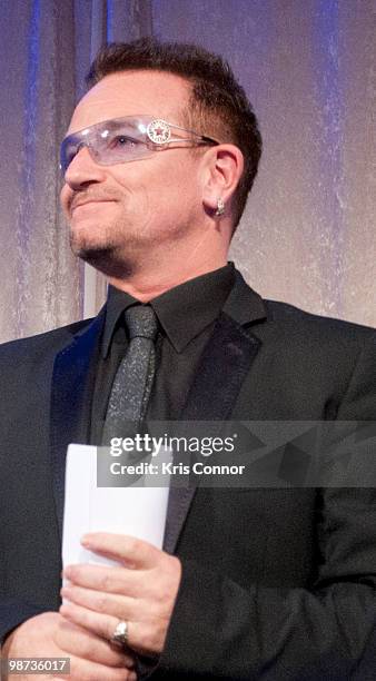 Frontman Bono speaks after being awarded the Distinguished Humanitarian Leadership Award during the 2010 Atlantic Council awards dinner at the Ritz...