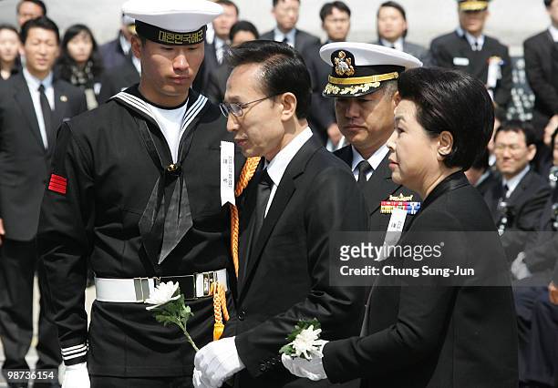 South Korean President Lee Myung-Bak and his wife Kim Yoon-Ok mourn during the funeral ceremony of sunken naval vessel Cheonan at Second Fleet...