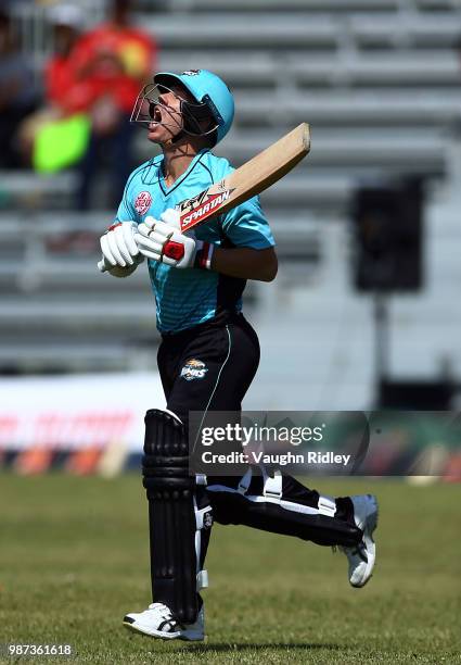 David Warner of Winnipeg Hawks reacts as he runs out to open the batting during a Global T20 Canada match against Montreal Tigers at Maple Leaf...