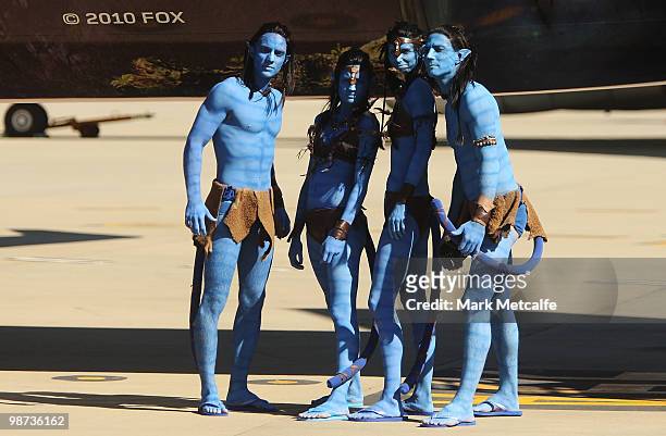 Models dressed up as characters from the film 'Avatar' pose in front of a branded plane during the launch of "AVATAR" Blu-ray and DVD at Sydney...