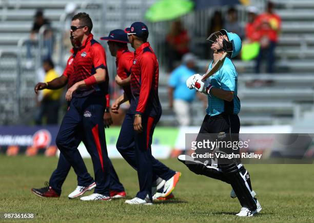 David Warner of Winnipeg Hawks reacts as he runs out to open the batting during a Global T20 Canada match against Montreal Tigers at Maple Leaf...