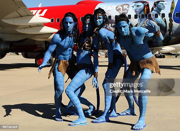 Models dressed up as characters from the film 'Avatar' pose in front of a branded plane during the launch of "AVATAR" Blu-ray and DVD at Sydney...