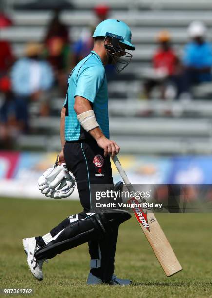 David Warner of Winnipeg Hawks walks off after being bowled by Lasith Malinga of Montreal Tigers during a Global T20 Canada match at Maple Leaf...