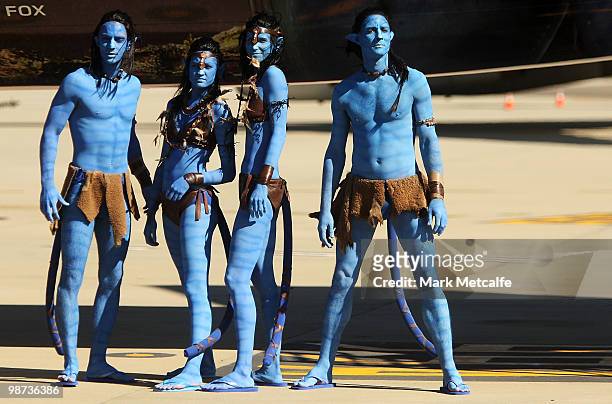 Models dressed up as characters from the film 'Avatar' pose during the launch of "AVATAR" Blu-ray and DVD at Sydney Domestic Airport on April 29,...
