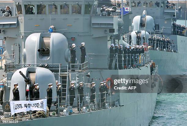 South Korean sailors pay their final respects from warships at a naval base in Pyeongtaek on April 29, 2010 to the 46 sailors killed when the warship...