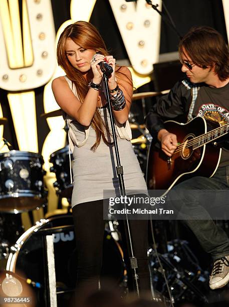 Miley Cyrus performs onstage at the Make A Wish Foundation's "World Wish Day" event held at The Grove on April 28, 2010 in Los Angeles, California.