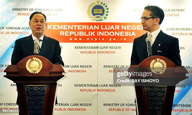 Indonesian Foreign Minister Marty Natalegawa listens on his Thai counterpart Kasit Piromya speaks during a joint press conference at the foreign...