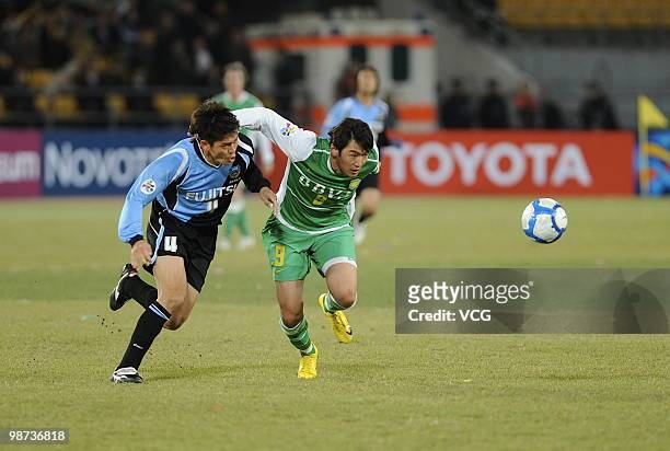 Yusuke Igawa of Kawasaki Frontale fights for a ball with Wenhui Du of Beijing Guoan during the AFC Champions League Group E match between Beijing...