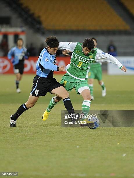 Yusuke Igawa of Kawasaki Frontale fights for a ball with Wenhui Du of Beijing Guoan during the AFC Champions League Group E match between Beijing...