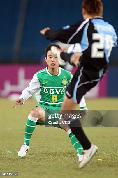Hiroyuki Taniguchi of Kawasaki Frontale fights for a ball with Yang Hao of Beijing Guoan during the AFC Champions League Group E match between...