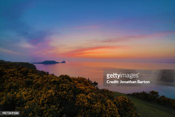 rhossili sunset - rhossili stock pictures, royalty-free photos & images