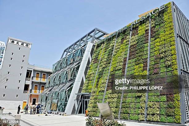 Workers are seen next to the Alsace pavilion at the Puxi side of the World Expo 2010 site in Shanghai on April 29, 2010. After the 2008 Beijing...