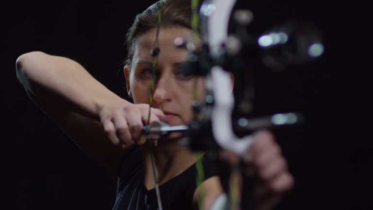 https://media.gettyimages.com/id/987371210/video/female-archer-shooting-bow-against-black-background.jpg?b=1&s=640x640&k=20&c=c4-vYBP5rSxc_Y6hbX166vEabMGQMf30XpfDbLhG8zc=