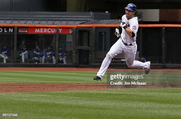 Angel Pagan of the New York Mets heads for third base for a second inning 2 run triple against the Los Angeles Dodgers on April 28, 2010 at Citi...